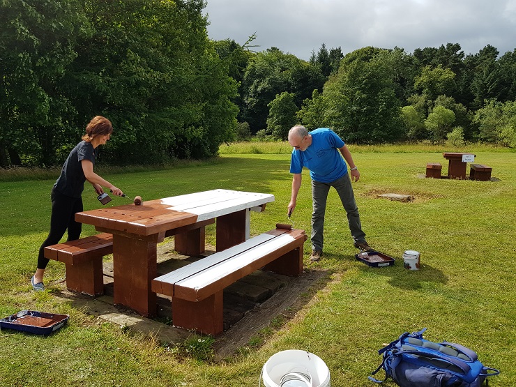 Forth River Trust volunteers painting a bench