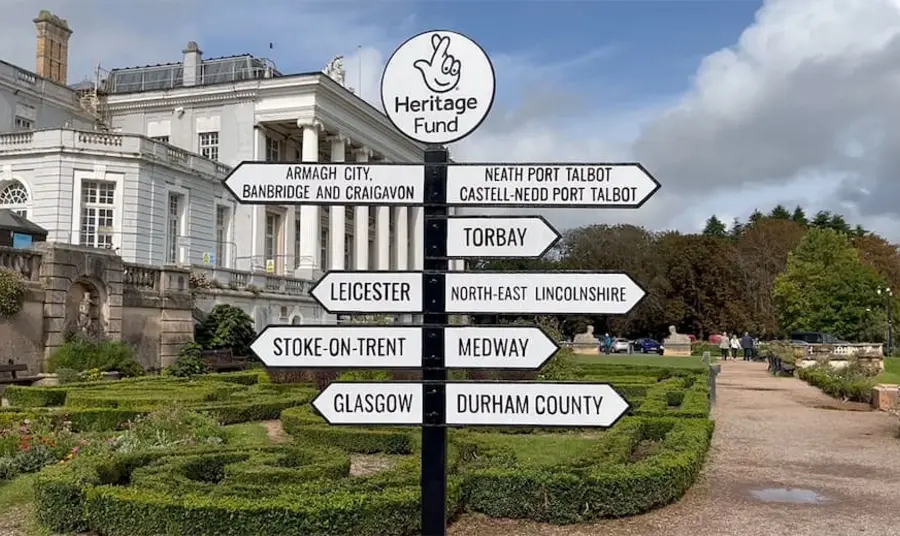 A mock directional sign pointing to the nine Heritage Places