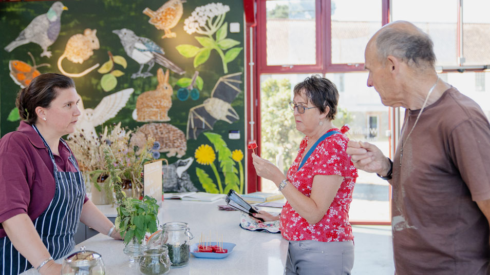 Visitors try food that was made with ingredients found in hedgerows