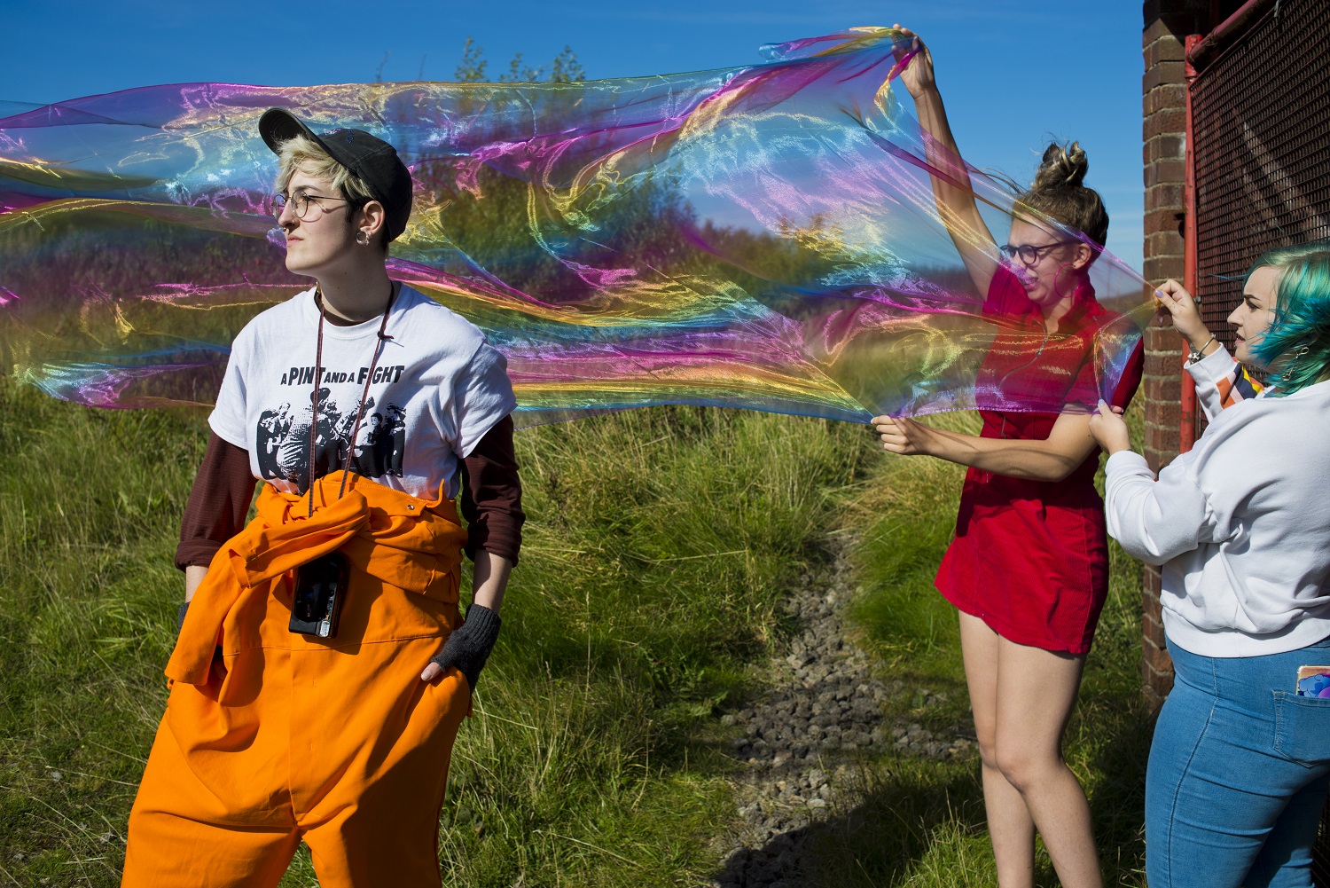 People with a rainbow bubble