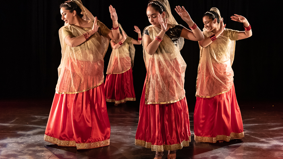 Four Asian women dancing