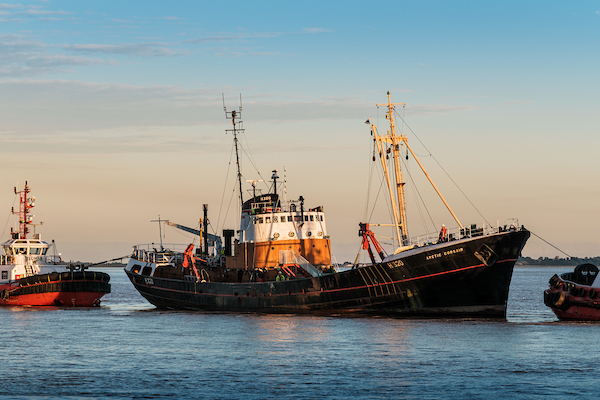 The Arctic Corsair ship being moved to a shipyard