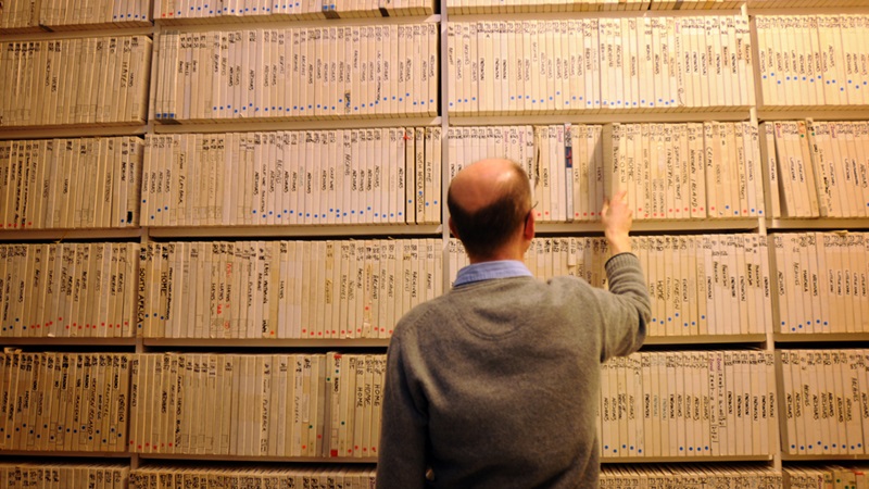 Man looking through archive