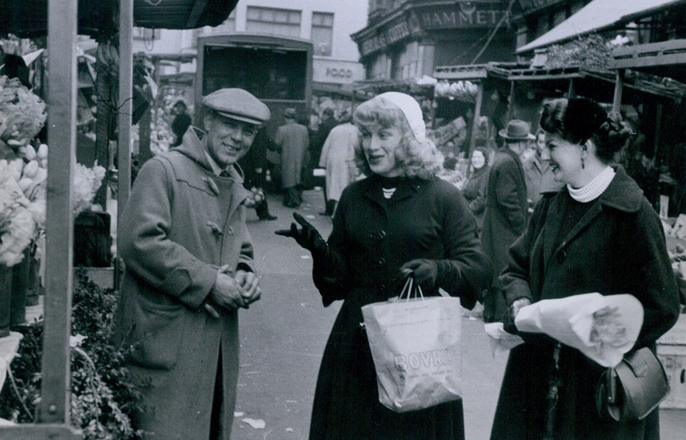 Three people shopping