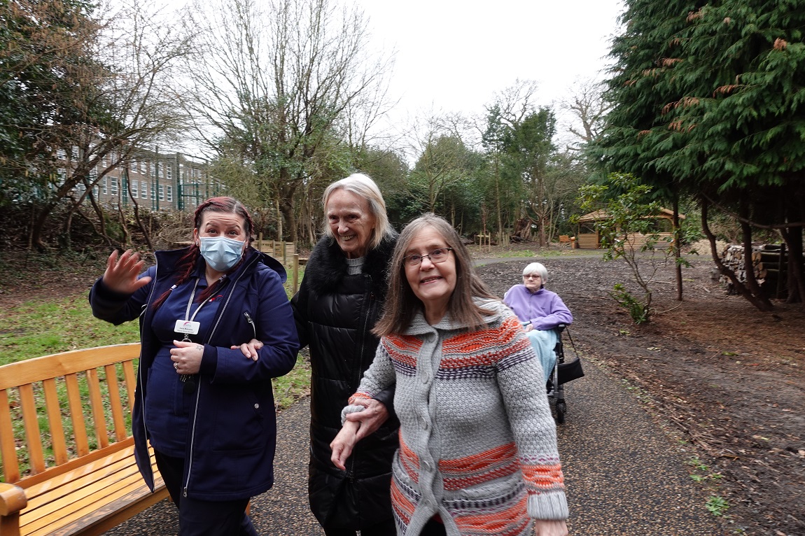 Carers and Hall Grange residents walking through The Wilderness