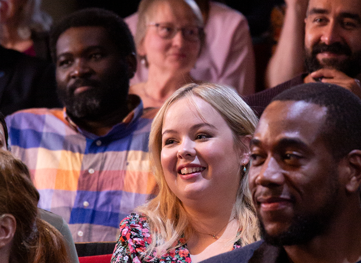 Nicola Coughlan sitting in an audience