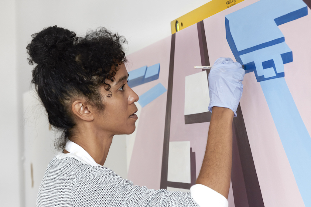 Woman painting an art piece for Eastside Projects at Birmingham Festival 2022