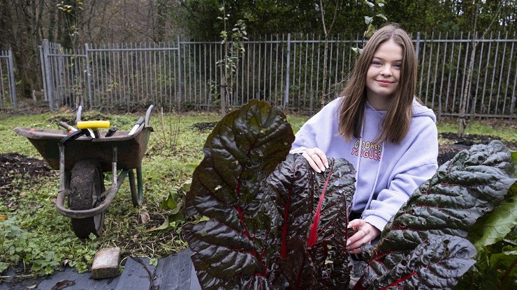 Young woman with rhubarb