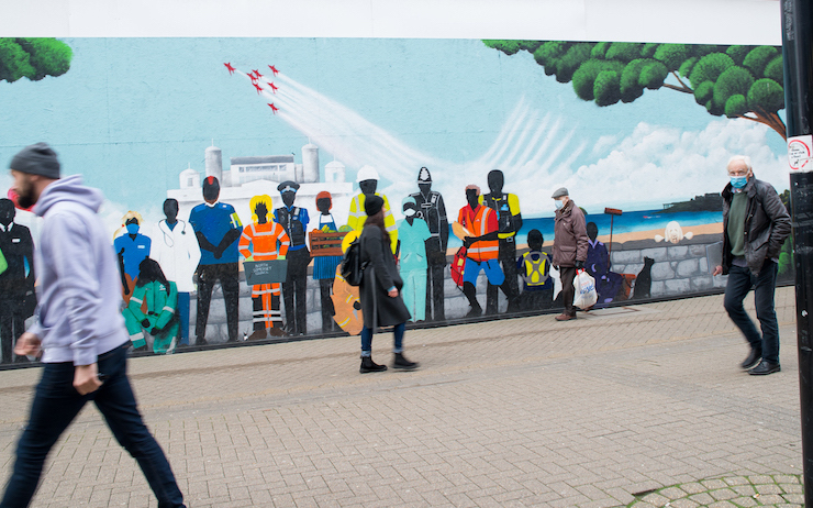 Writer Rebecca Tantony walks past the graffiti mural on Weston high street