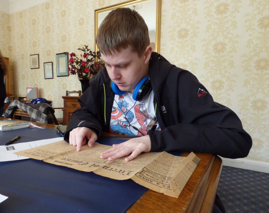 Person looking at historical document 