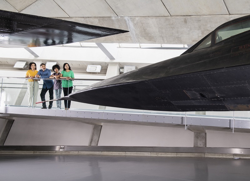 People looking at an airplane