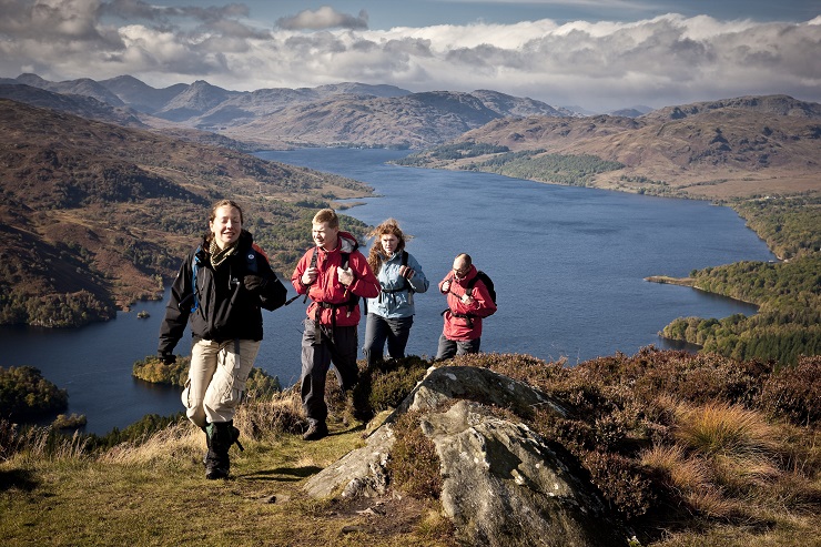 People walking along Loch Lomond