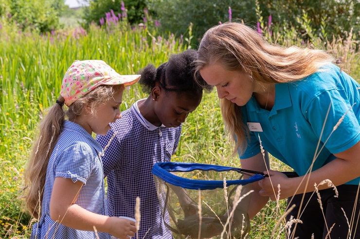 Two children and an adult with nets at Slimbridge Wetland Centre