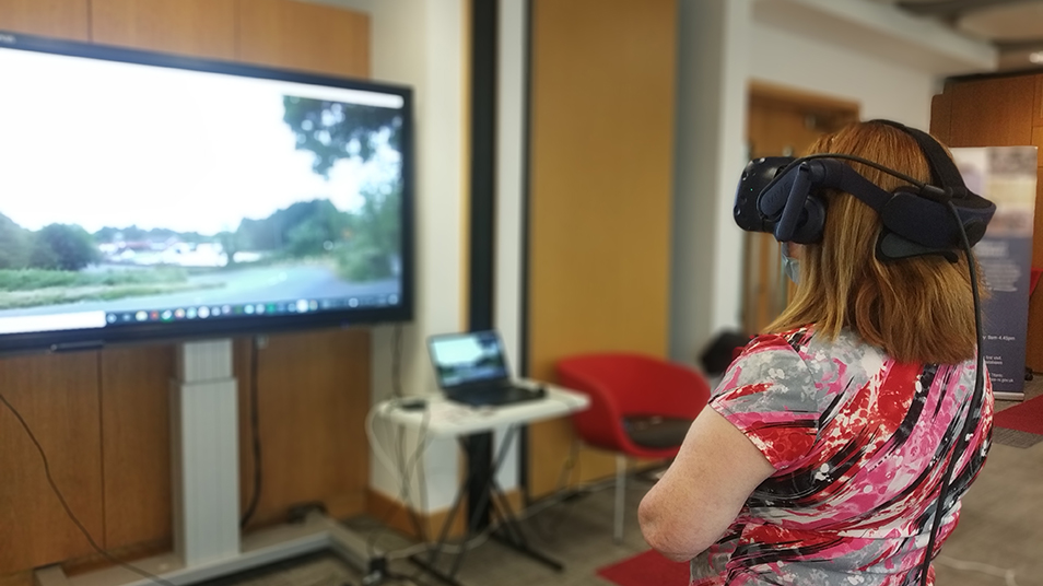 Person with a virtual reality headset on watching a 360 film created during a project with PRONI