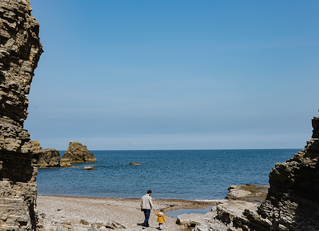 Father and child on the beach