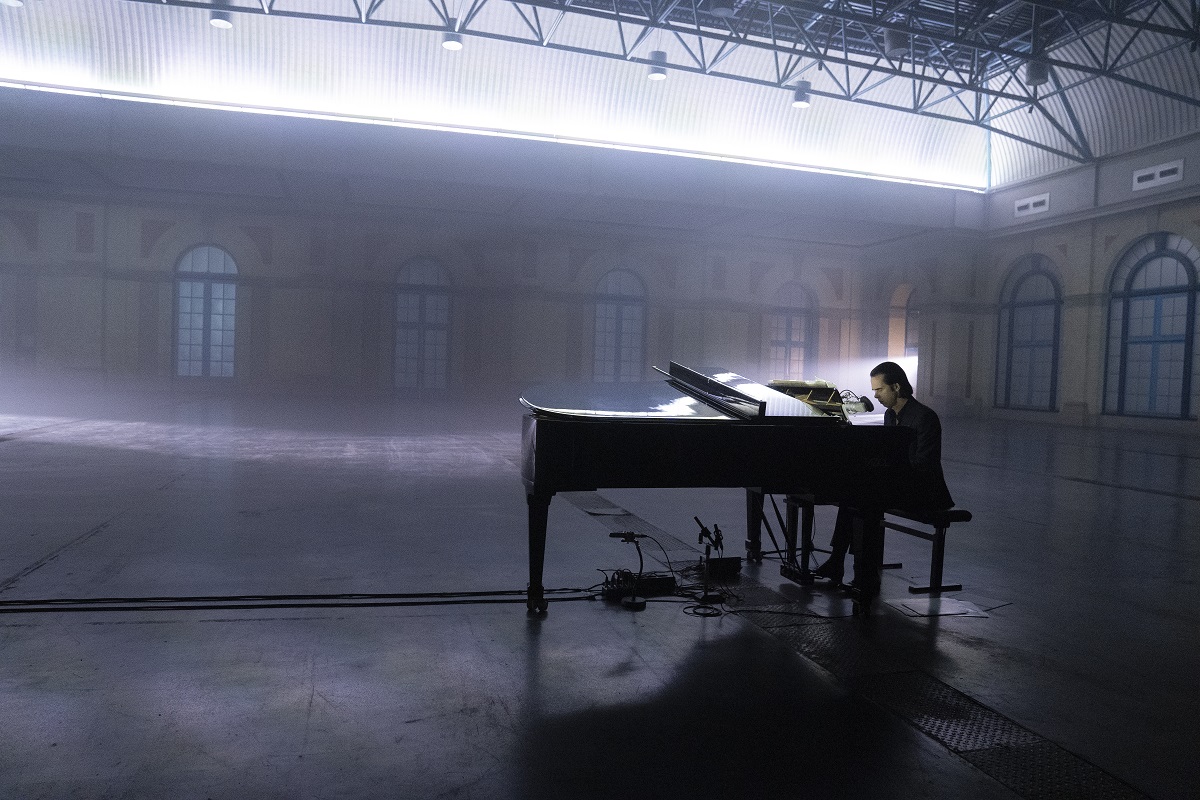 Man playing piano to empty room