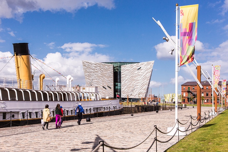 Titanic Belfast and SS Nomadic docked in front of building