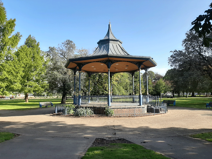 A bandstand in a park on a sunny day