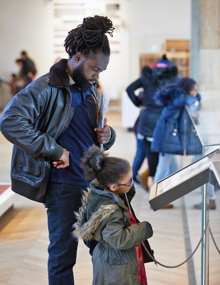 Man and child enjoy exhibit at The Wellcome Galleries