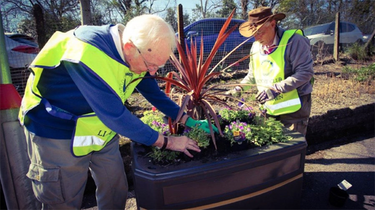 Volunteers with a planter