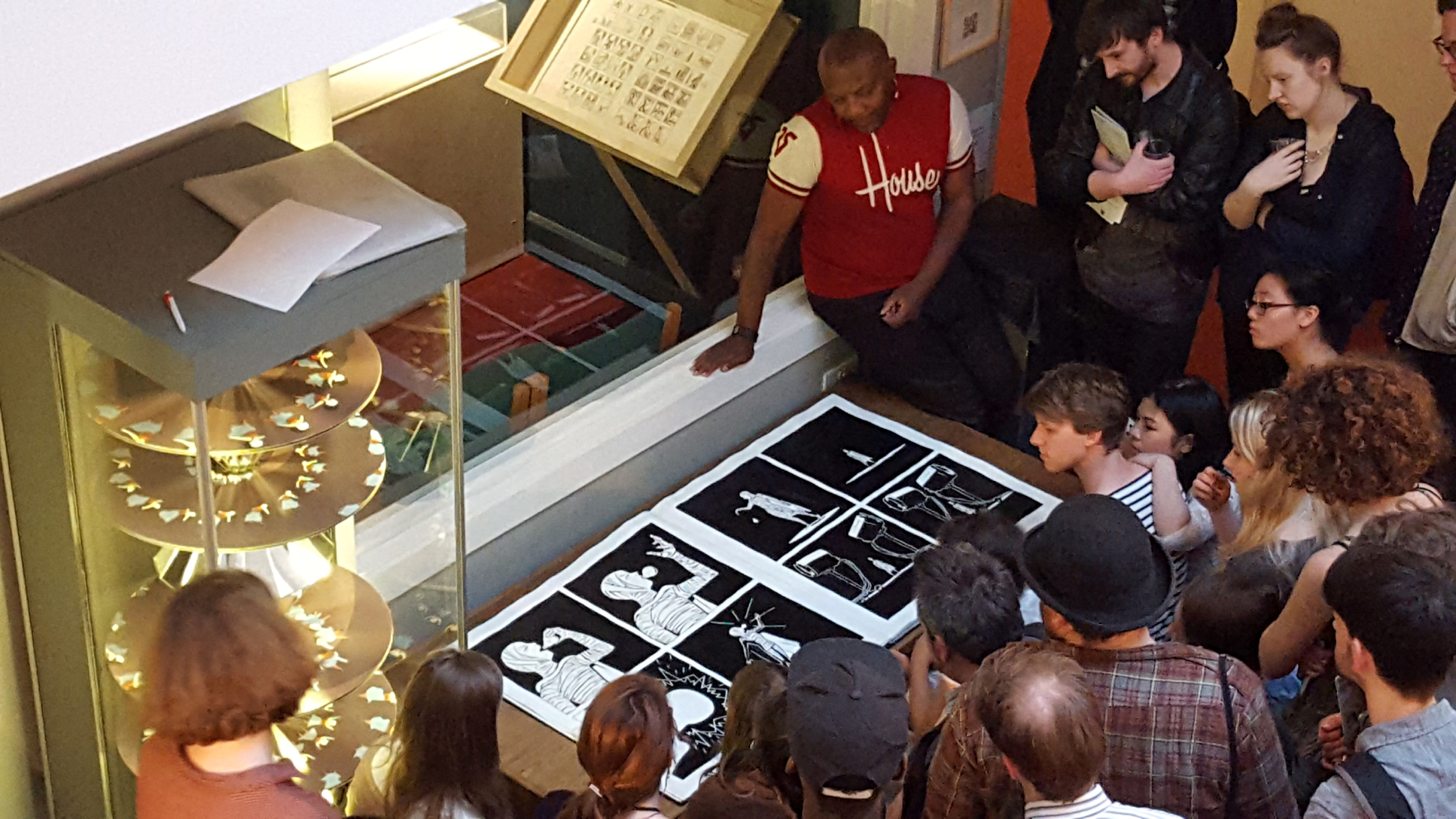 People viewing a piece of comic book art