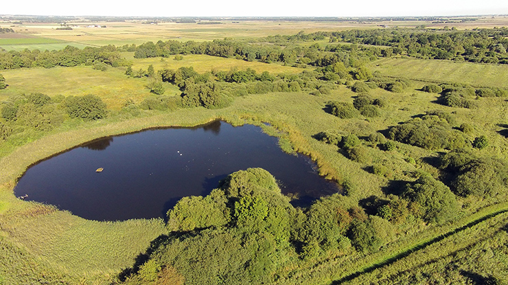 Aerial view of the Great Fen with lake