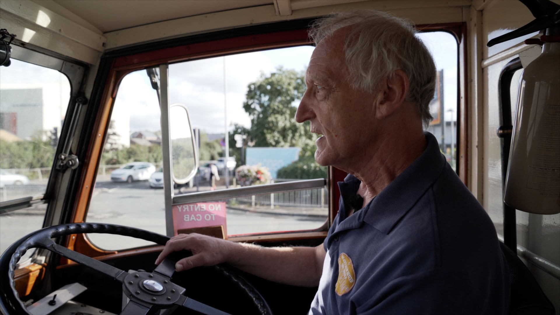 Man driving a vintage fire engine