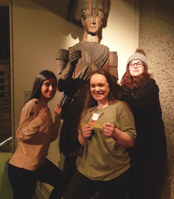 Three young women in museum