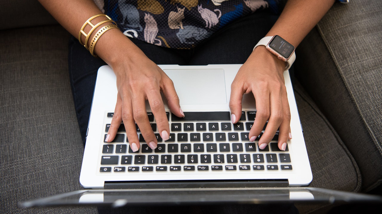 Hands using computer keyboard