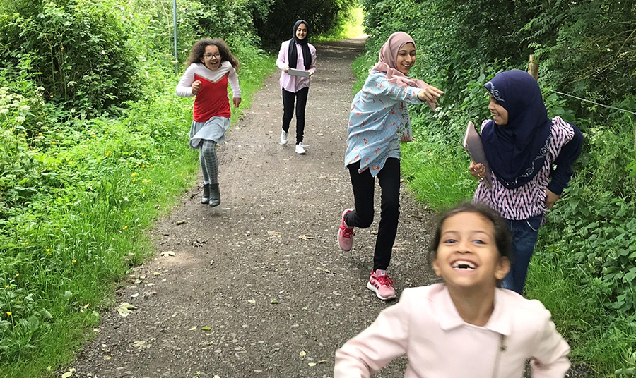 Girls running in countryside