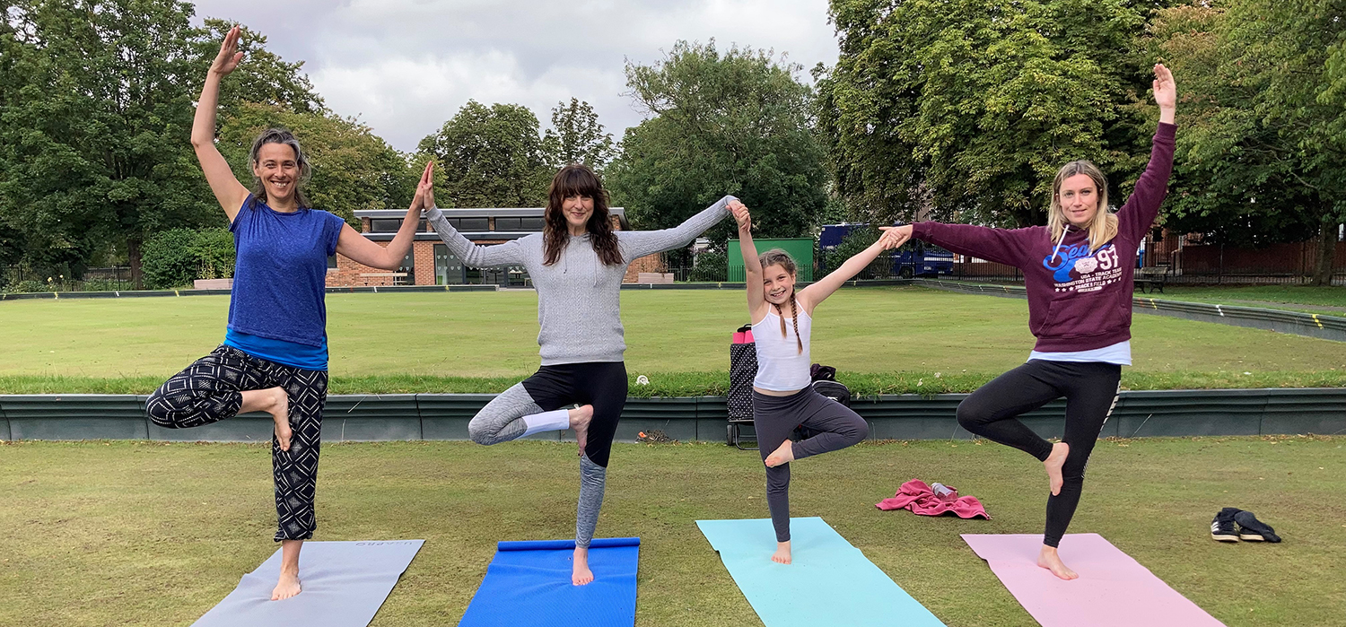 People doing yoga outside