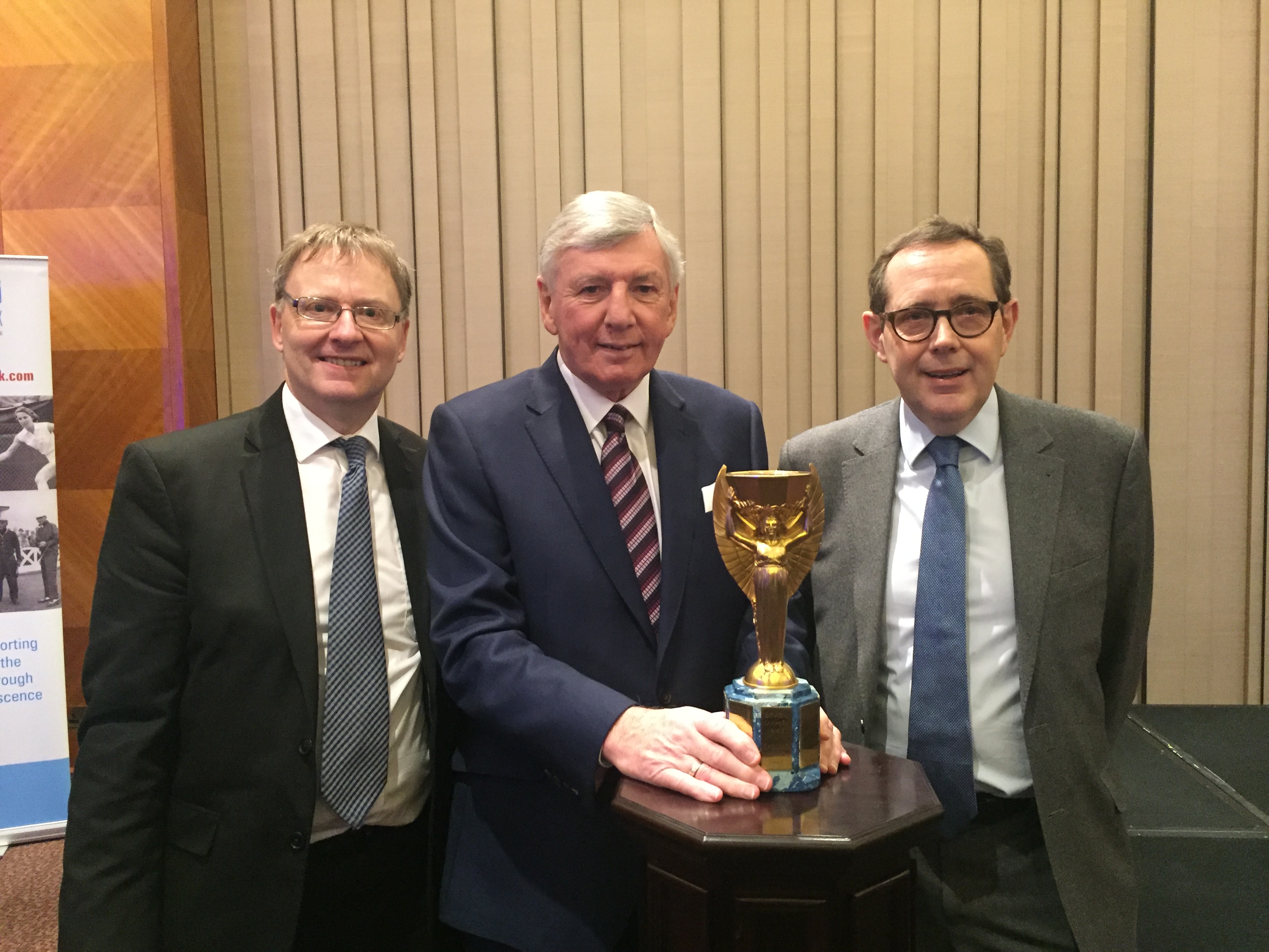 Is 2016 a bumper year for heritage anniversaries? HLF's chair Sir Peter Luff pictured with the Jules Rimet trophy, World Cup player Martin Peters and Kevin Moore, Director of the National Football Museum