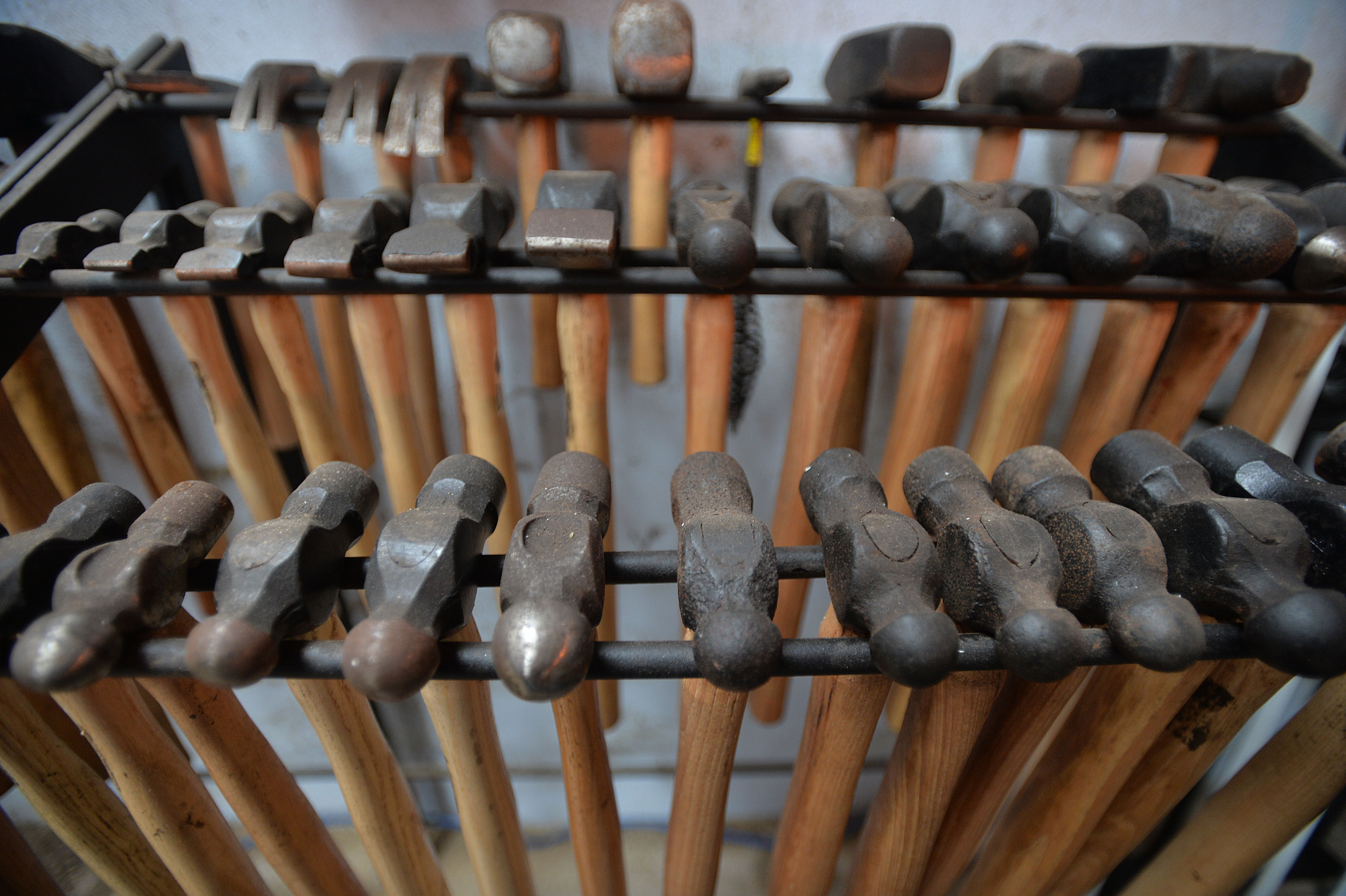 A rack of blacksmith tools A rack of blacksmith tools