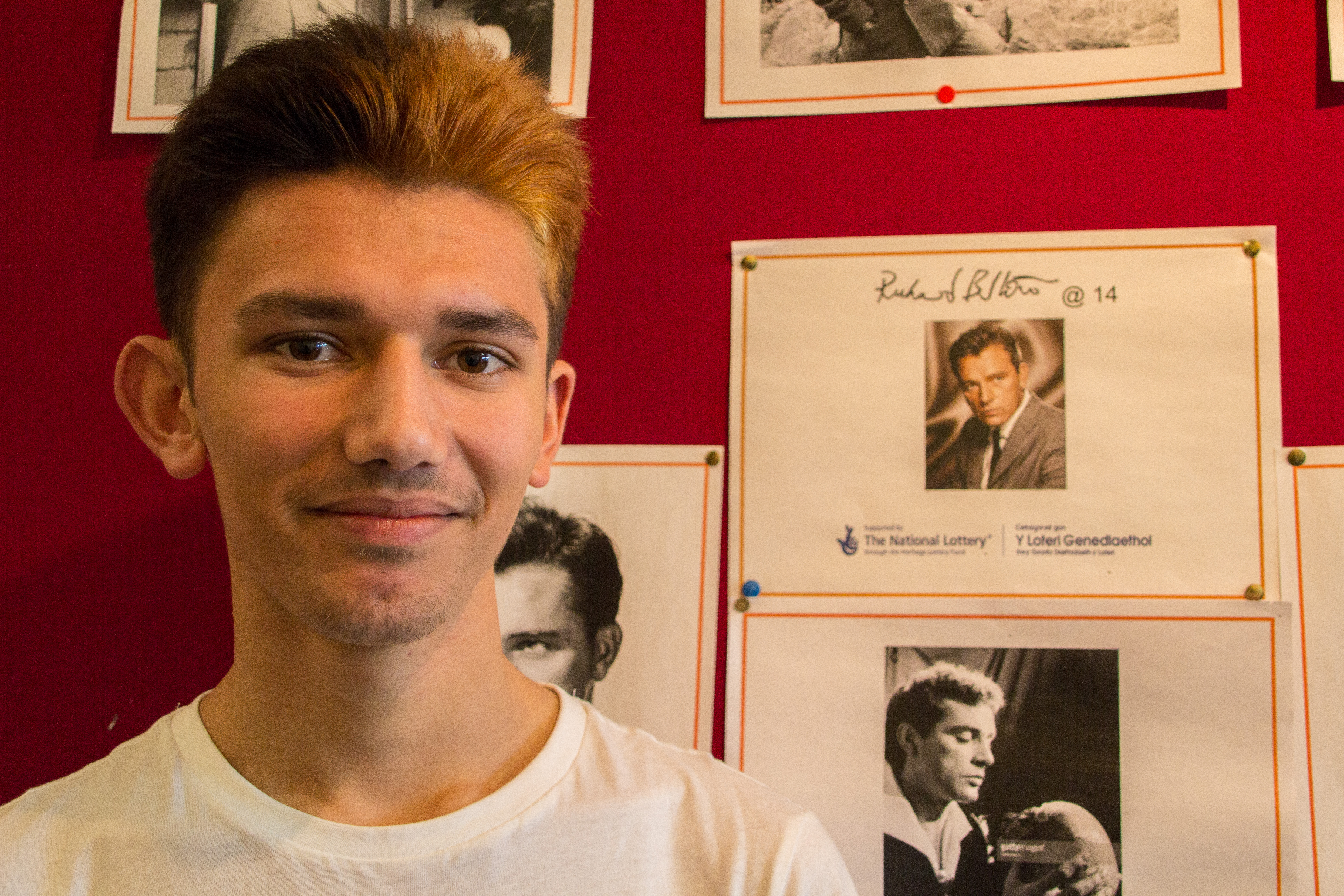Changing lives: instilling confidence in Port Talbot teens Abdul next to the project display