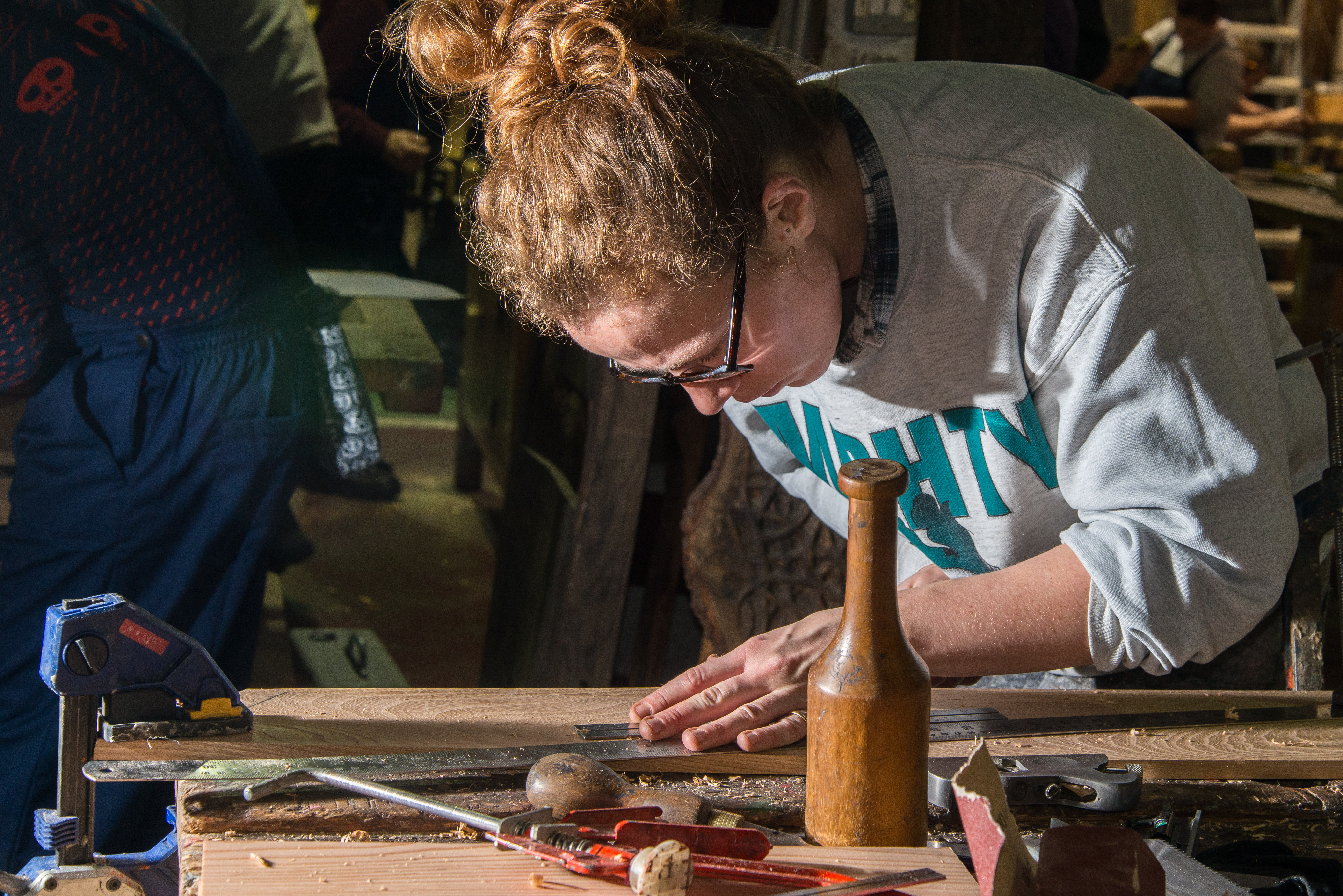 A woman does woodwork A woman does woodwork