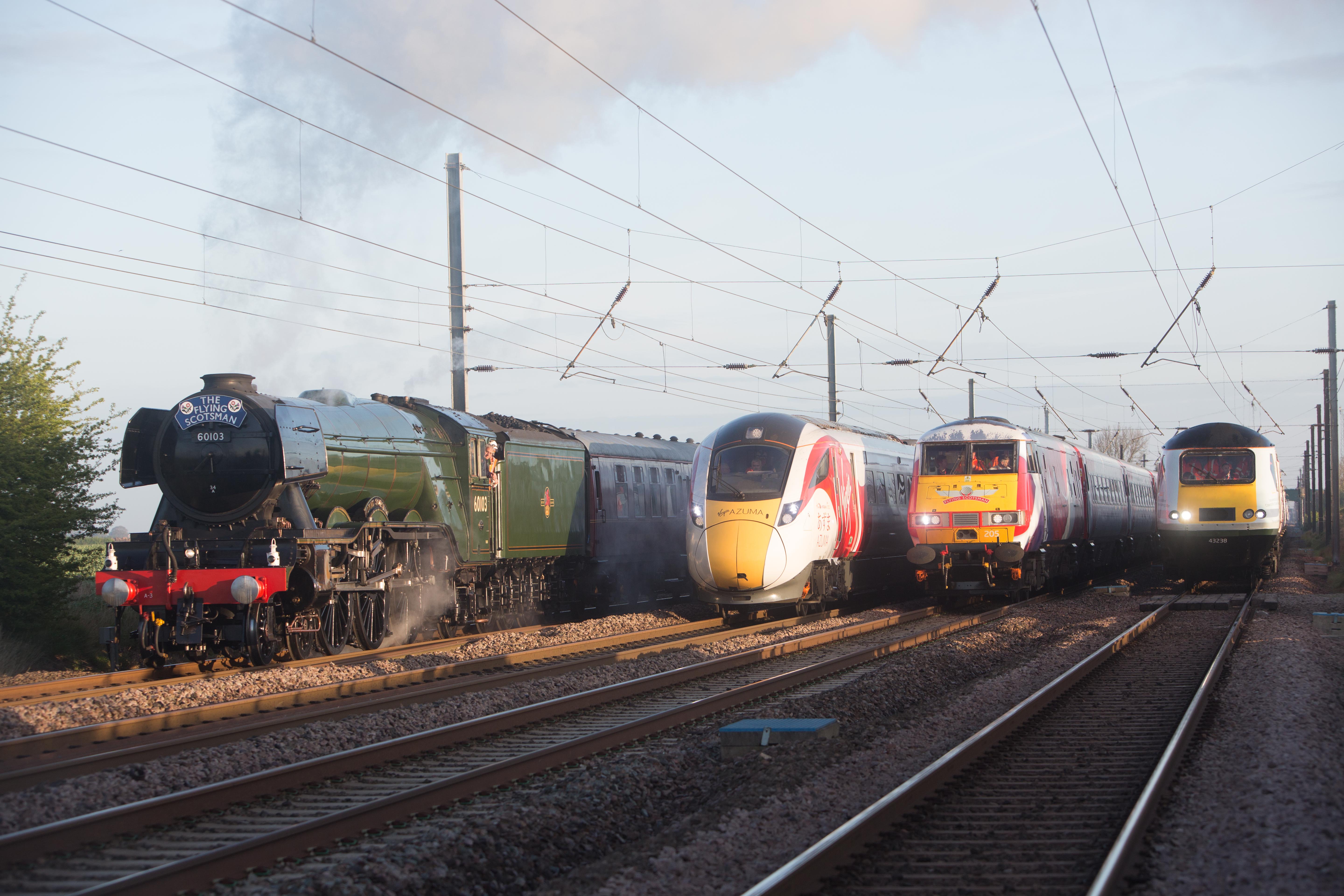 The Flying Scotsman alongside modern train stock The Flying Scotsman alongside modern train stock