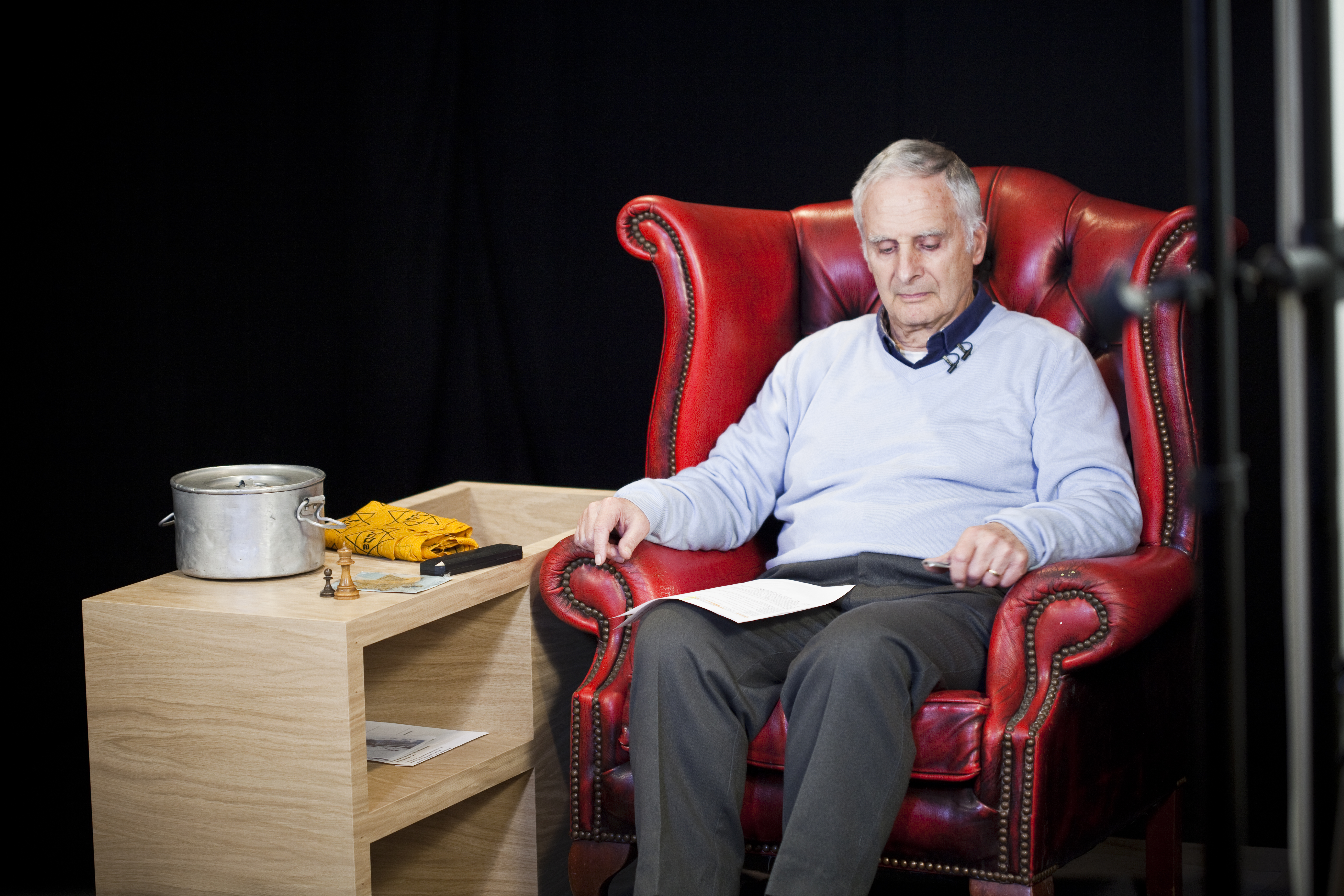 Steven prepares to be filmed on the Forever project Steven, sitting in a chair, reads notes and prepares to be filmed on the Forever project