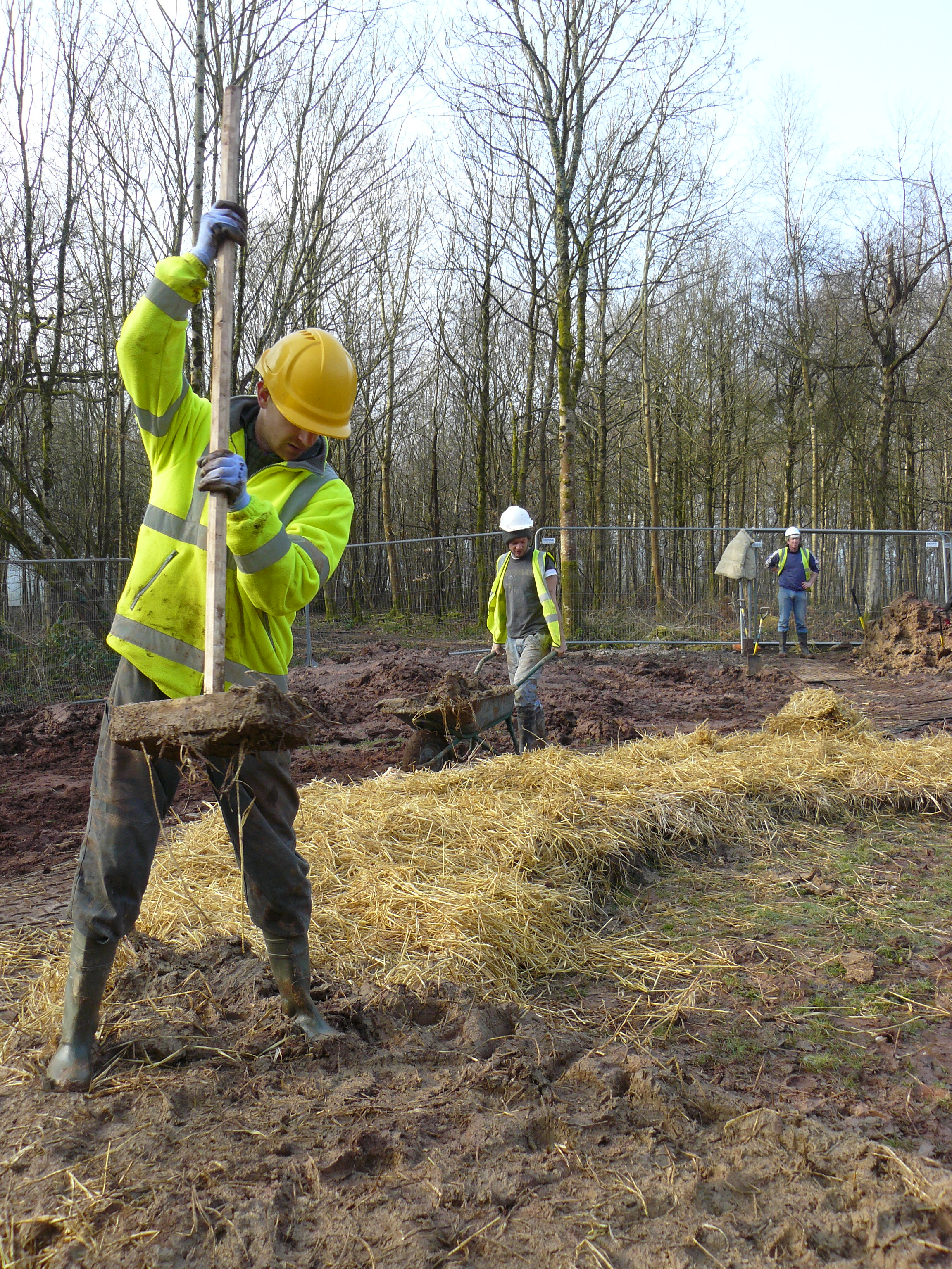 A volunteer lays foundations for Bryn Eryr A volunteer lays foundations