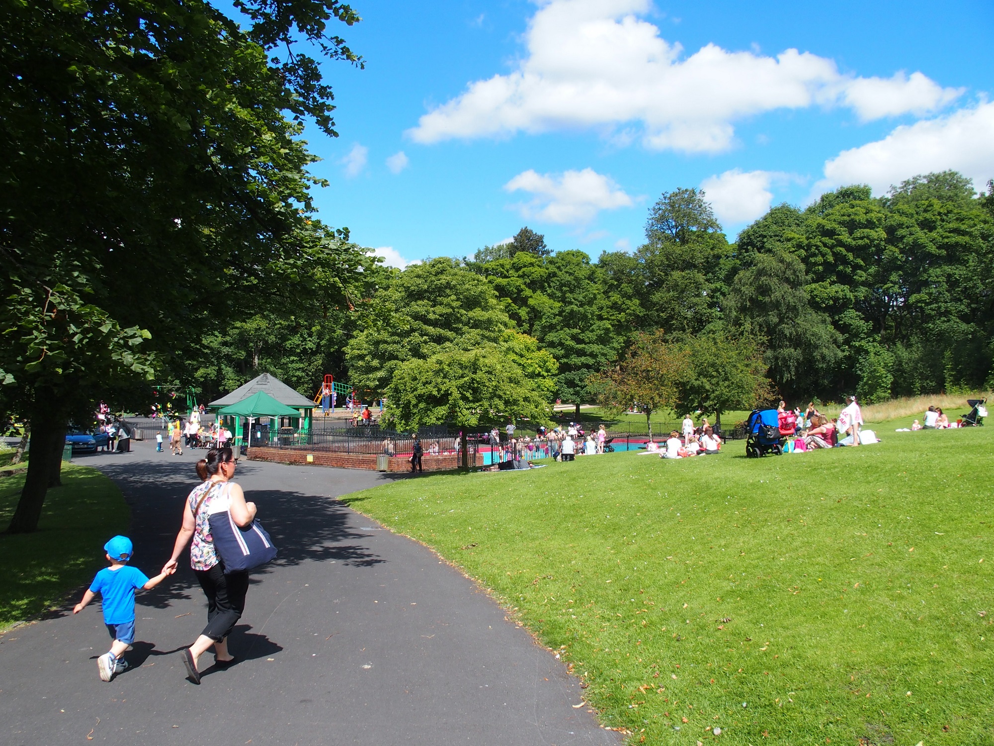 Families enjoying the sun in Thompson Park, Burnley Families enjoying the sun in Thompson Park, Burnley
