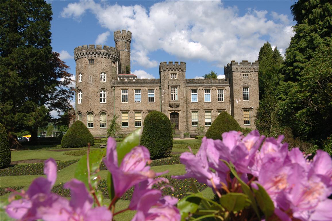 Heritage building surrounded by flowers in Cyfarthfa Park, South Wales Heritage building surrounded by flowers in Cyfarthfa Park, South Wales