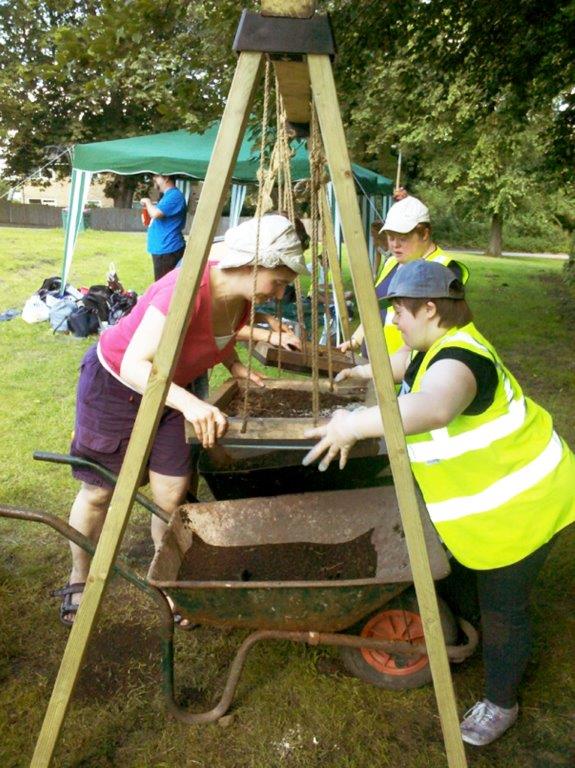 Staveley community excavation, Derbyshire Participants use swing sieves at a community excavation project