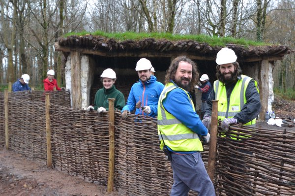 Volunteers from homeless charity The Wallich Volunteers at Iron Age farmstead Bryn Eryr