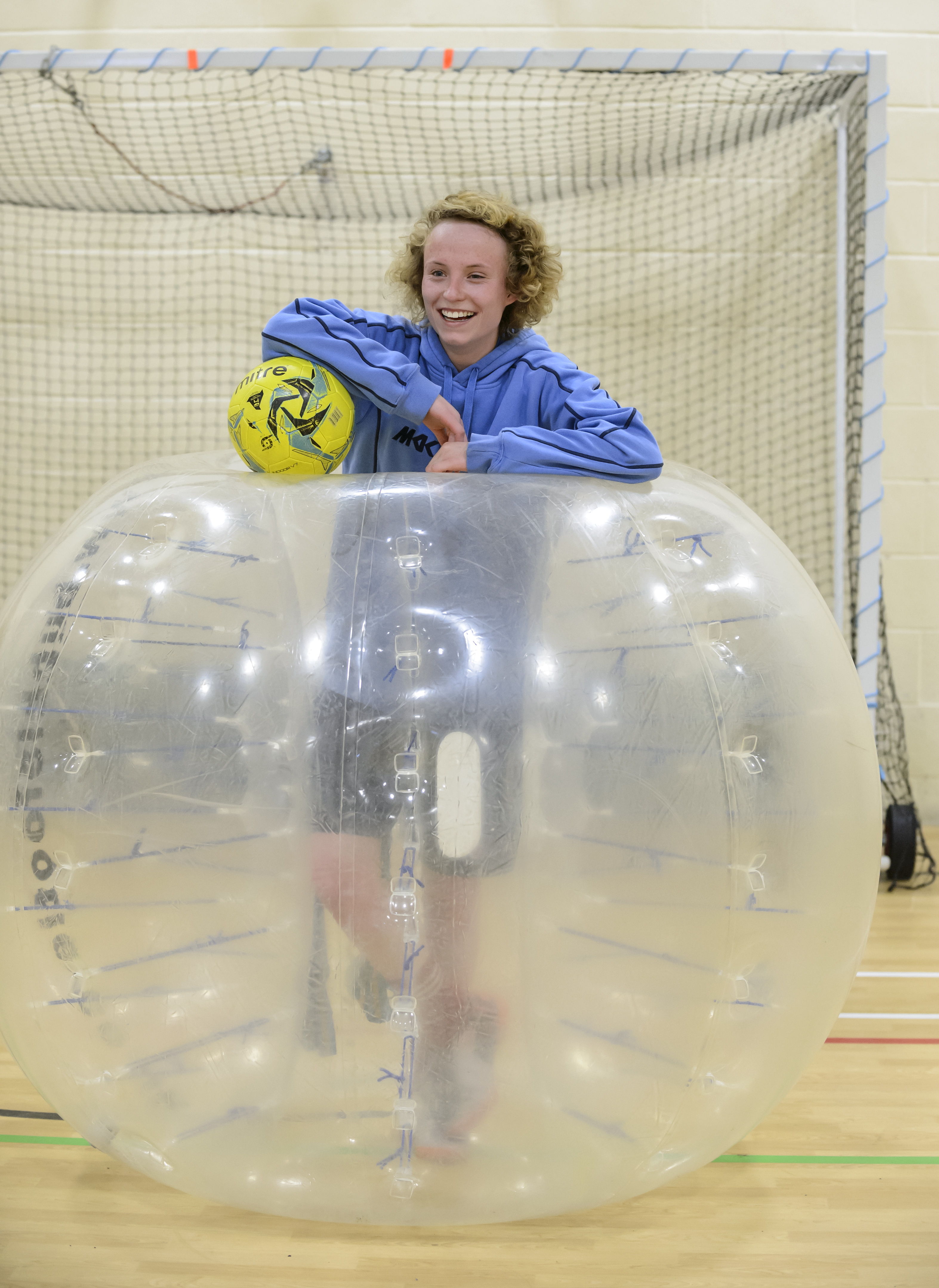 Danielle Pointon in a zorb with a football Danielle Pointon in a zorb with a football