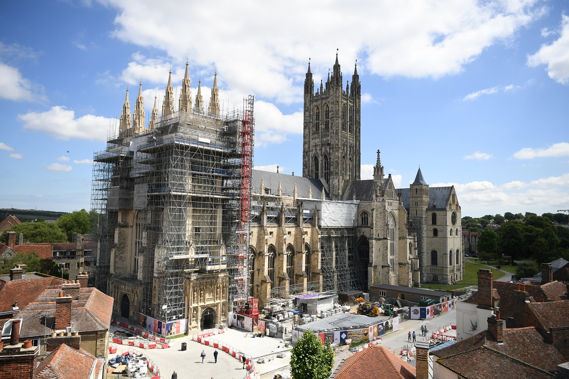 An exterior shot of Canterbury Cathedral with scaffolding and building works on the outside