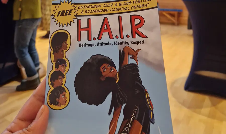 A flyer for H.A.I.R featuring a comicbook style illustration of a person with an Afro 