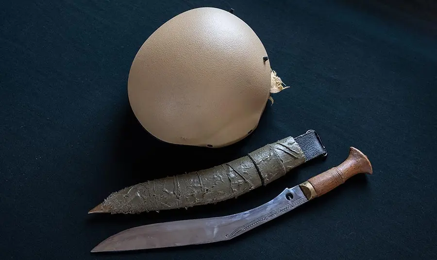 The modern military khukhuri and helmet that belonged to Rifleman Tuljung Gurung