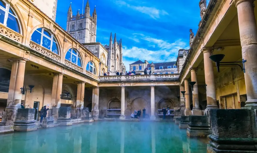 View of The Great Bath in Bath, Somerset, showing the water surrounded by Roman architecture.
