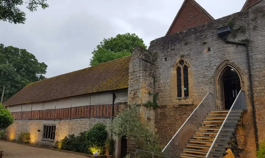 Abingdon Abbey building lit up at dusk