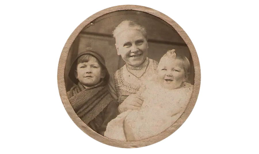 a historic photograph of Mary Blagg as an older woman with two children, believed to be Belgian refugees during the First World War
