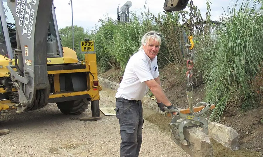 Brian Pearce MBE is with a crane working on the site.